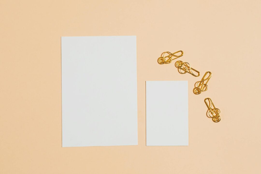 Paperlust save the date cards displayed as a set with envelope on soft neutral background, elegant design showing a suite of matching statio