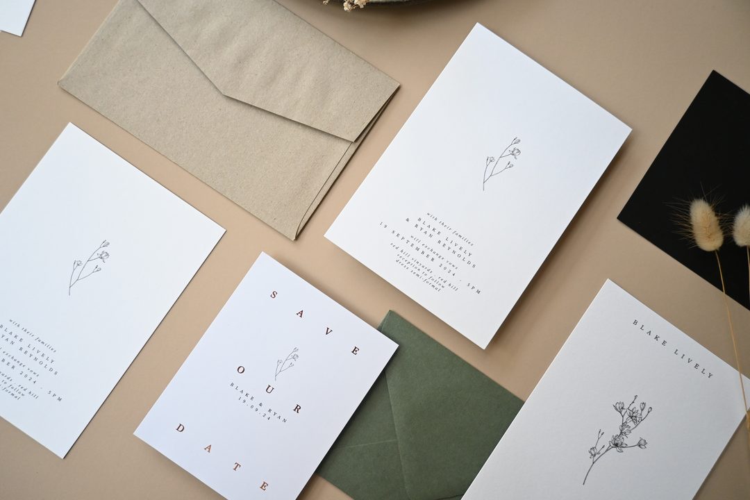 Paperlust invitation, Beautifully styled flatlay of a minimalist wedding stationery suite featuring delicate botanical line drawings