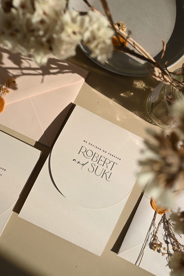 Paperlust invitation, Beautifully styled flatlay of a minimalist wedding invitation for Robert and Suki with warm