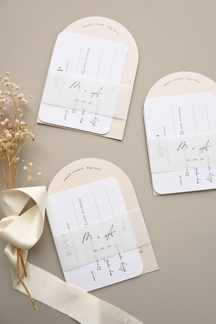 Paperlust invitation, Beautifully styled flat lay of three arch-shaped wedding invitation suites with RSVP cards
