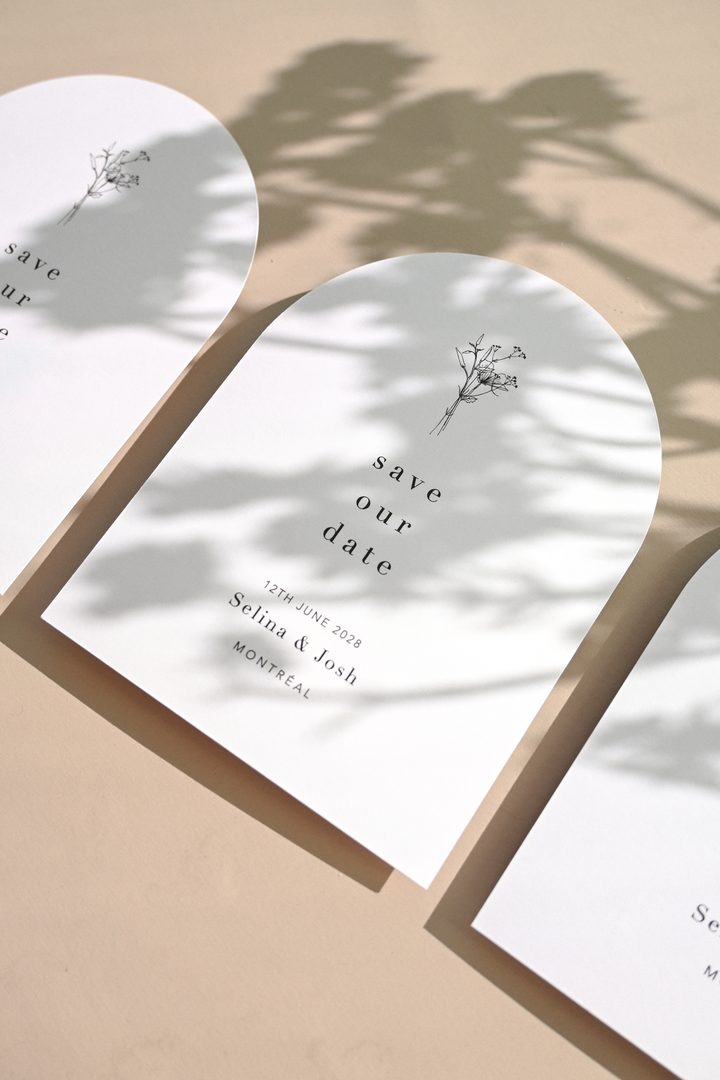 Paperlust invitation, Beautifully styled arch-shaped save the date cards with delicate botanical illustration