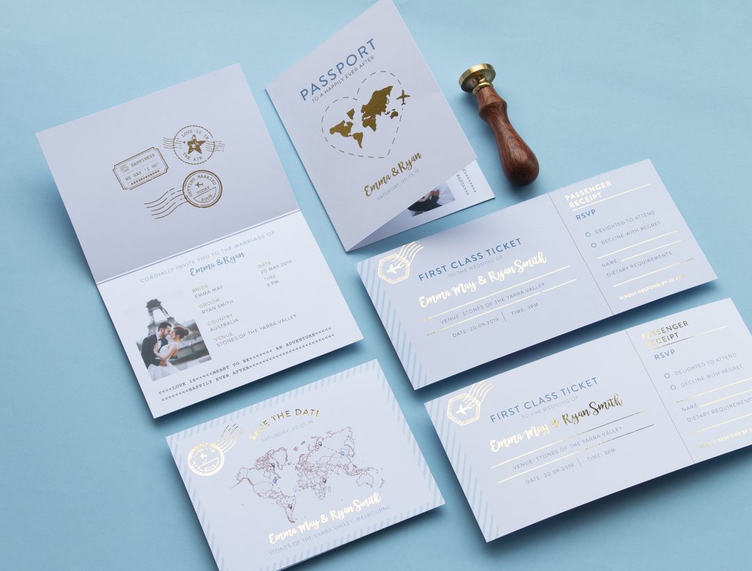 Paperlust invitation, Beautifully styled travel-themed wedding suite featuring passport and boarding pass designs with gold foil details. Australian identifiers visible including 'Stones of the Yarra Valley' venue and 'Country Australia' text.