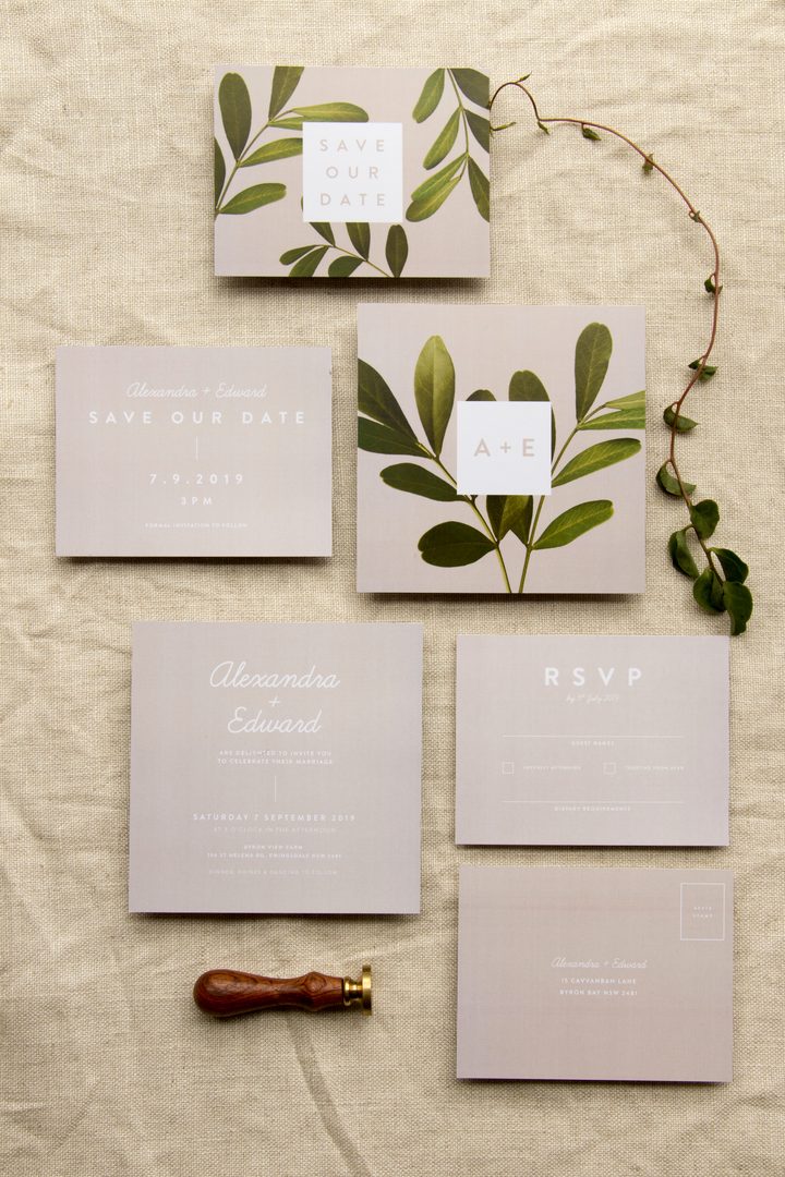 Paperlust invitation, Beautifully styled botanical wedding stationery suite flatlay with olive branch motif