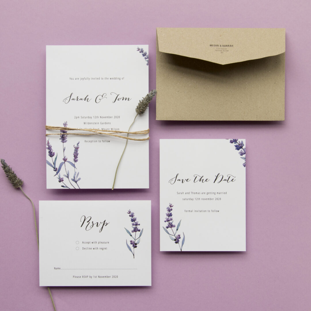 Paperlust Lavendula wedding invitation suite, white invitation with lavender purple botanical illustration on a lavender background, kraft envelope, dried lavender sprigs, twine accent