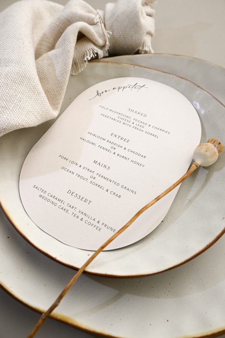 Paperlust menu, Beautifully styled wedding menu on an organic-shaped card