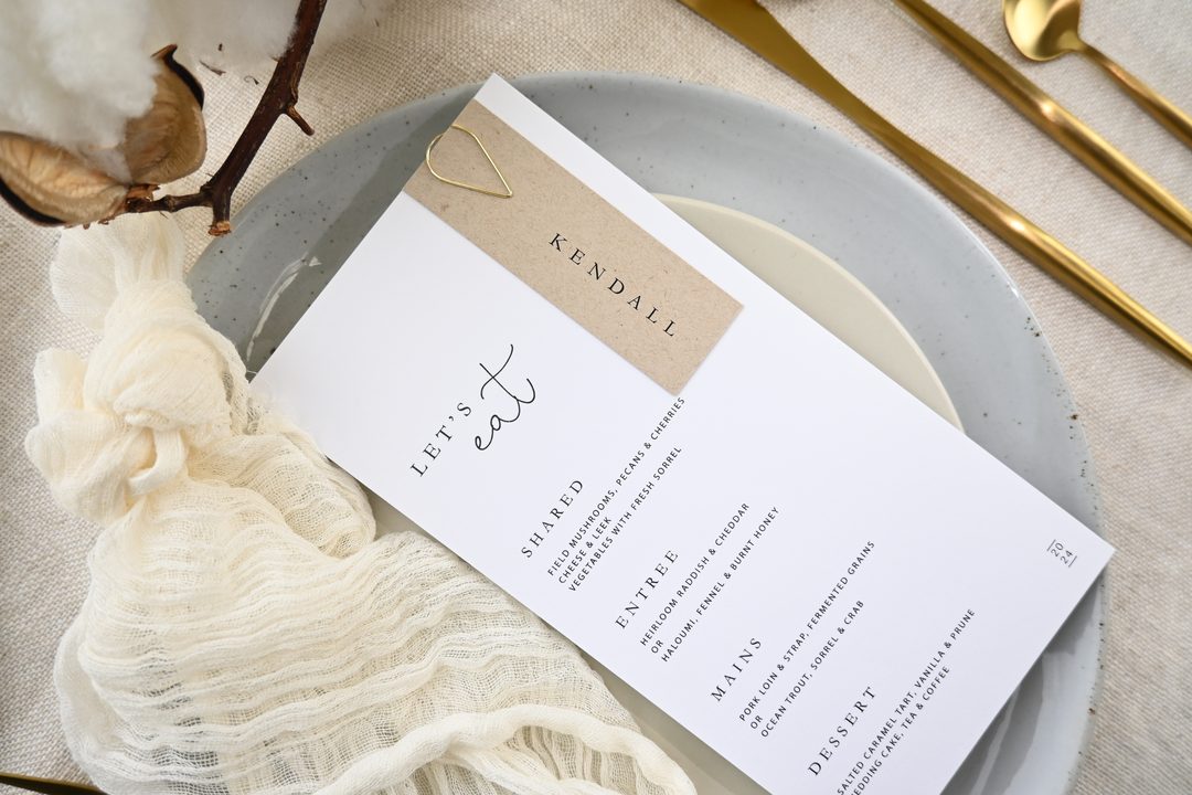 Paperlust program, Beautifully styled flatlay of a wedding menu with kraft place card tag