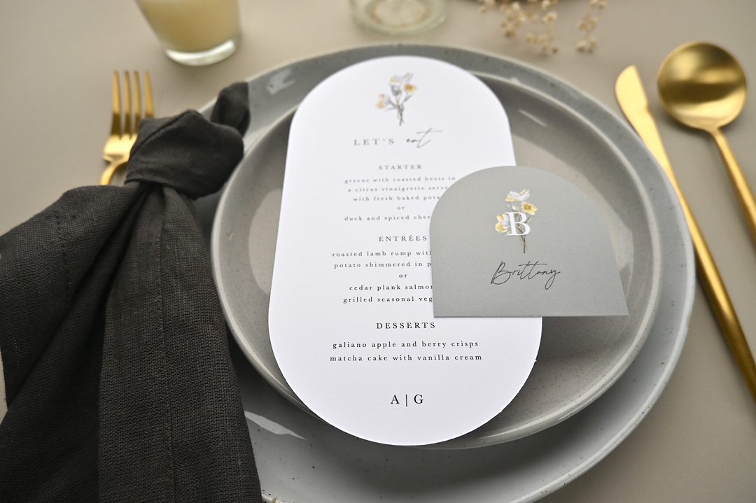 Paperlust program, Beautifully styled place setting featuring an oval menu card and arched place card with floral monogram