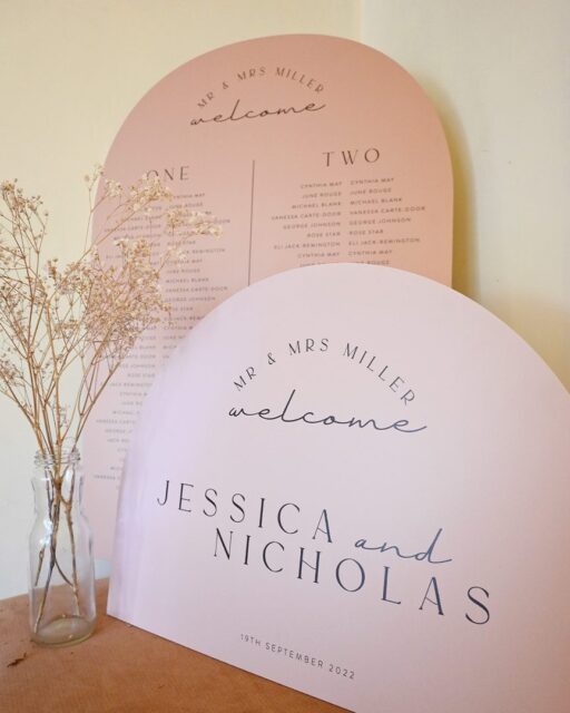 Paperlust seating chart, Wedding welcome sign and seating chart displayed together in a styled product shot. Soft blush/peach color palette with modern typography