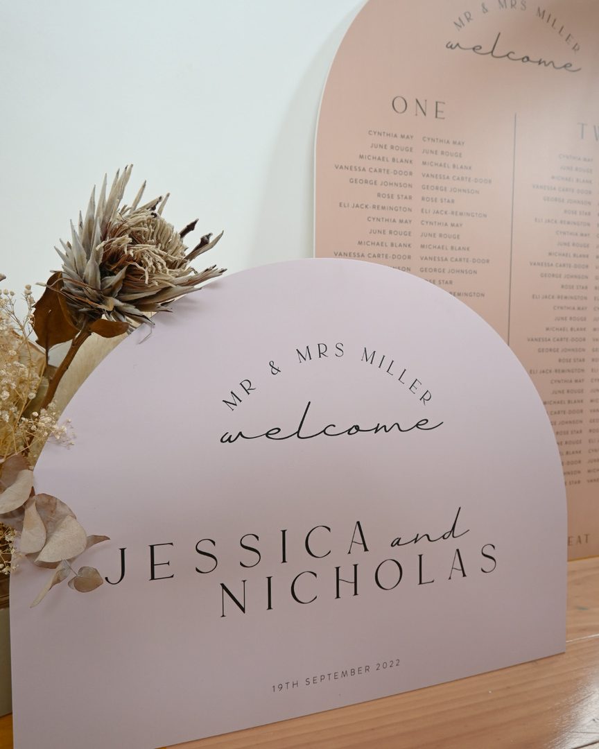 Paperlust seating chart, Elegant arch-shaped welcome sign for Mr & Mrs Miller featuring clean typography