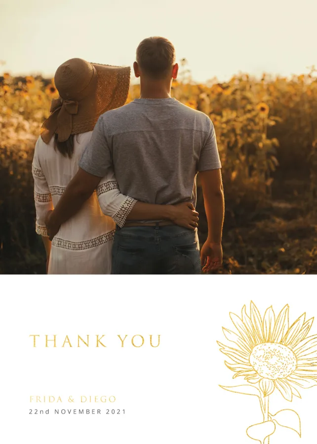 Paperlust Golden Sunflower wedding thank you card with a couple photo in a sunflower field at golden hour, gold foil thank you lettering and sunflower line art
