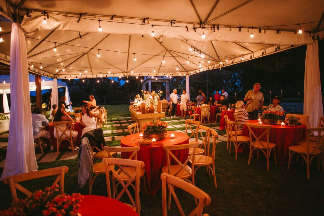 Wedding RENTAL inventory, tables, chairs, linens, a tent/marquee, lounge furniture, or tableware set up for a wedding