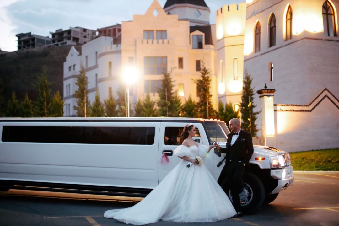 Wedding TRANSPORTATION, a limousine, luxury/classic car, or a couple arriving in or beside a wedding vehicle
