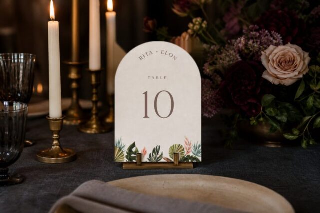 Paperlust table number, Island Breeze arched die-cut wedding table number on a candlelit reception table