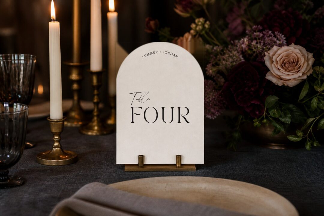 Paperlust table number, Sage arched die-cut wedding table number on a candlelit reception table