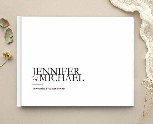Paperlust hardcover wedding guest book with a modern serif monogram cover