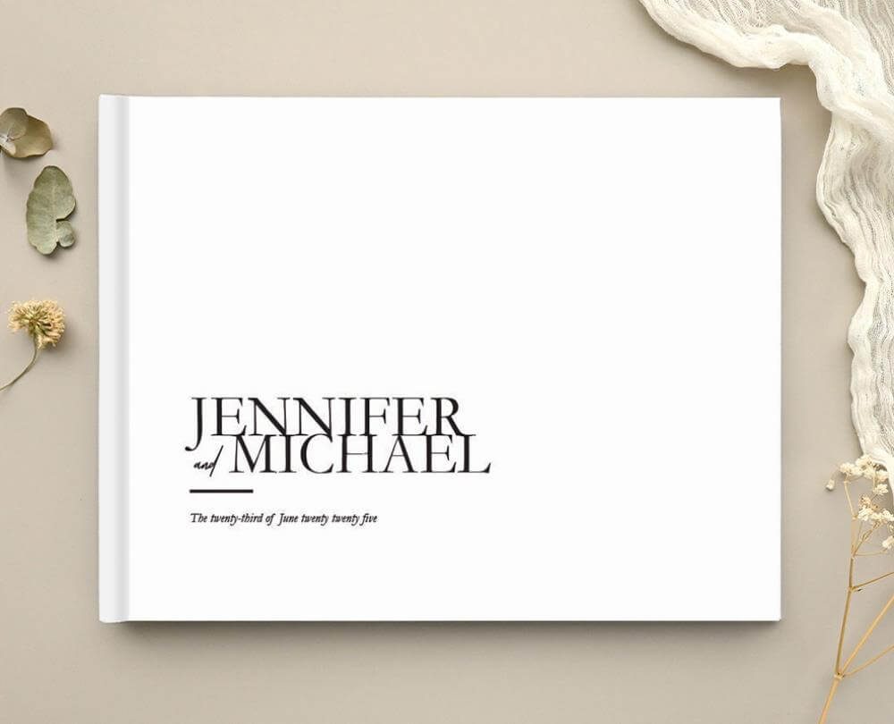 Paperlust hardcover wedding guest book with a modern serif monogram cover
