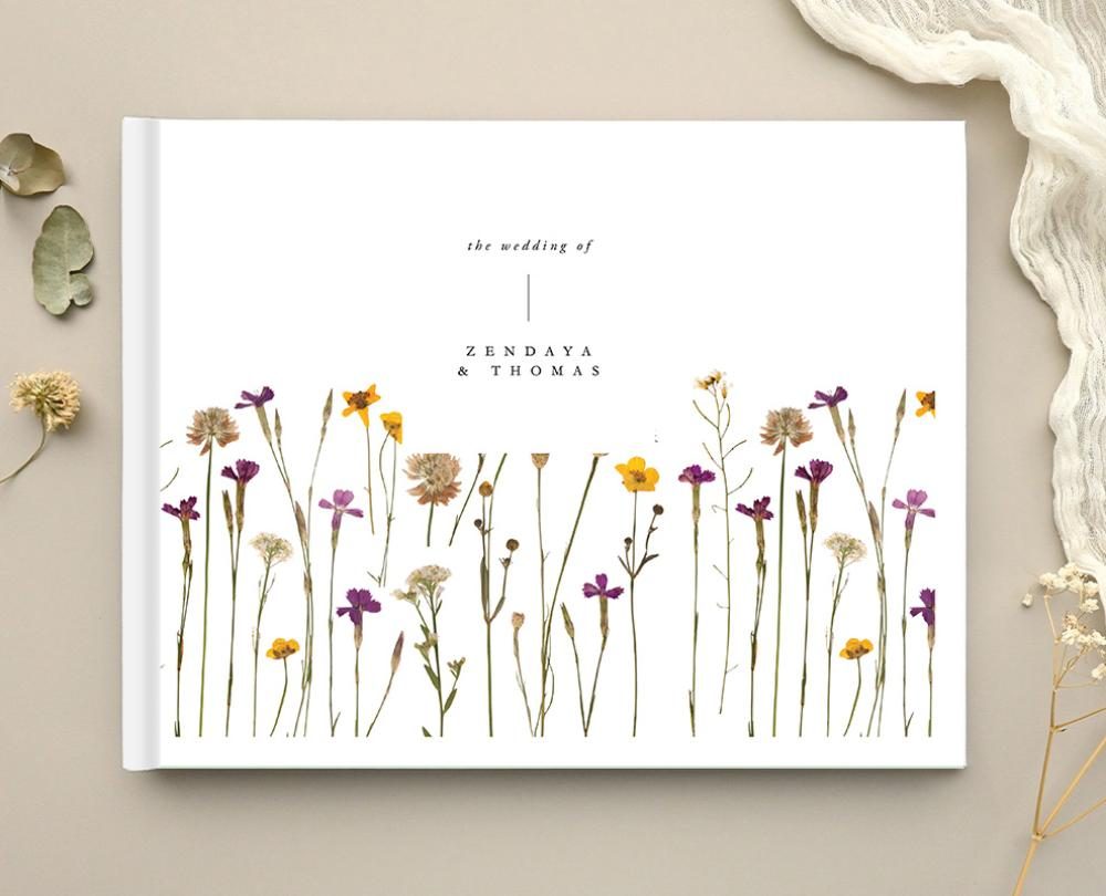 Paperlust wedding guest book with a pressed wildflower cover