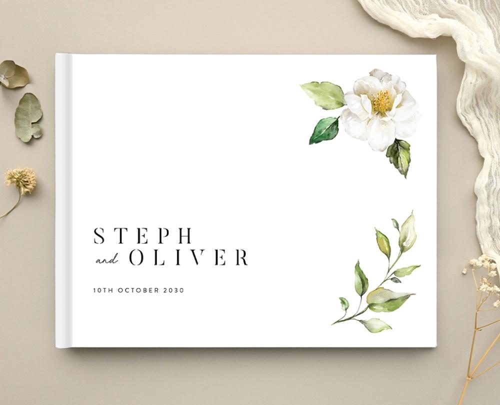 Paperlust wedding guest book with a white floral watercolor cover