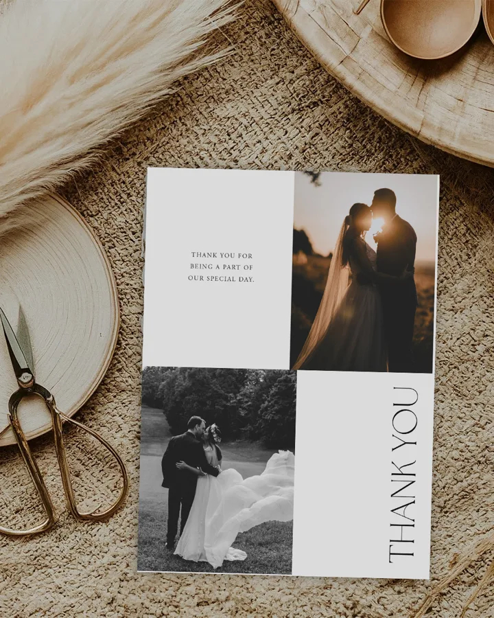 Paperlust Wildest Dreams wedding thank you card, a modern grid layout with two couple photos and vertical thank you text, styled with pampas grass and gold scissors