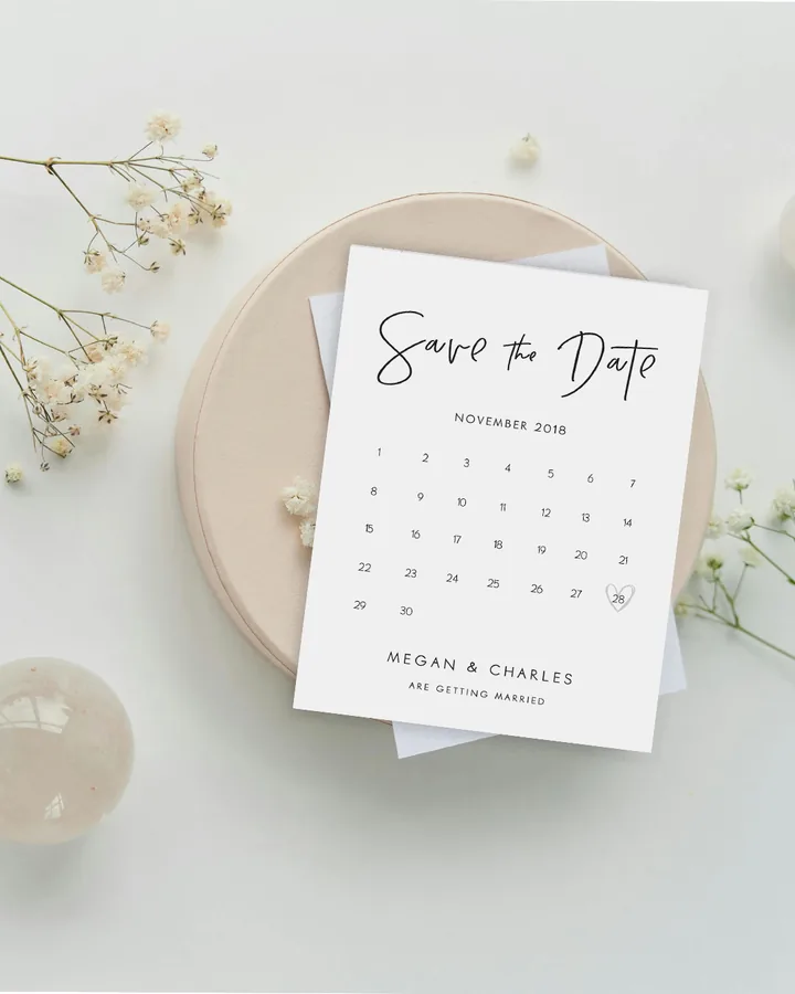 Paperlust Clair De Lune calendar save the date with a heart marking the wedding date on a November calendar grid