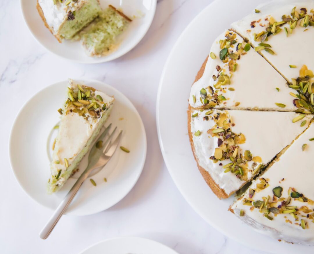 An overhead view of individual wedding cake slices plated for a tasting