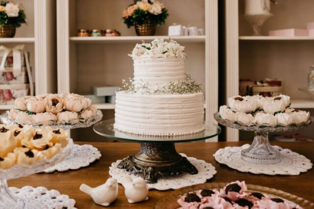 Wedding CAKE TASTING, a couple and/or baker tasting cake samples, plated cake slices at a tasting/consultation