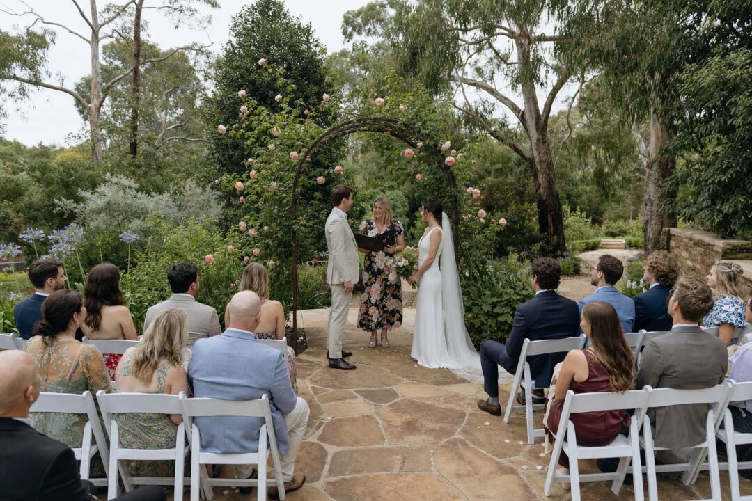 Intimate garden wedding ceremony at a state botanic garden.