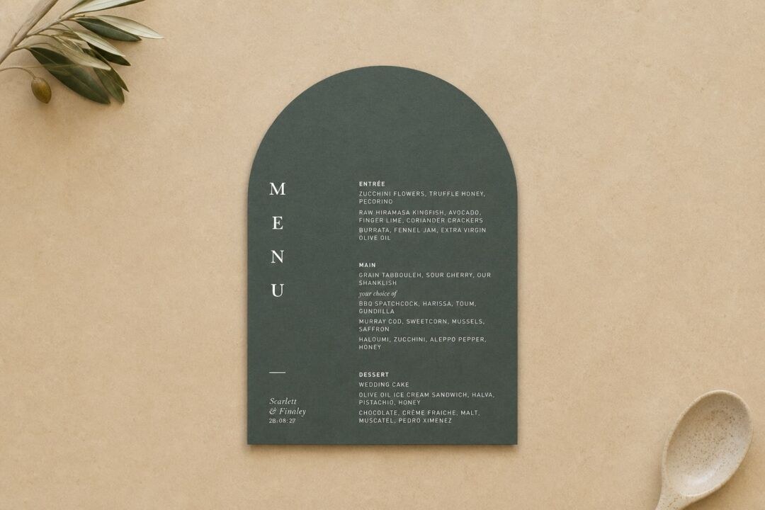 A wedding menu die-cut to a single wide arch, printed in white ink on sage green colourstock.