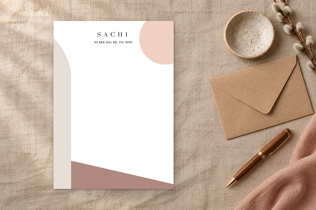 Paperlust Neutral Palette notecard shows blush pink, beige and clay brown geometric shapes and SACHI on sand linen cloth.